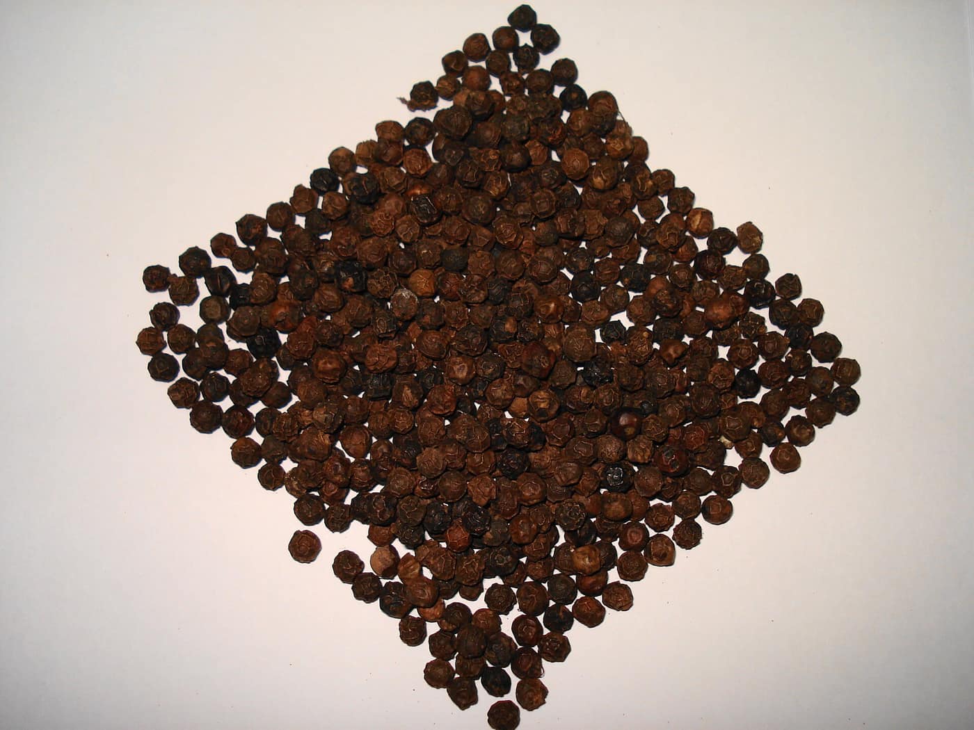Whole black peppercorns